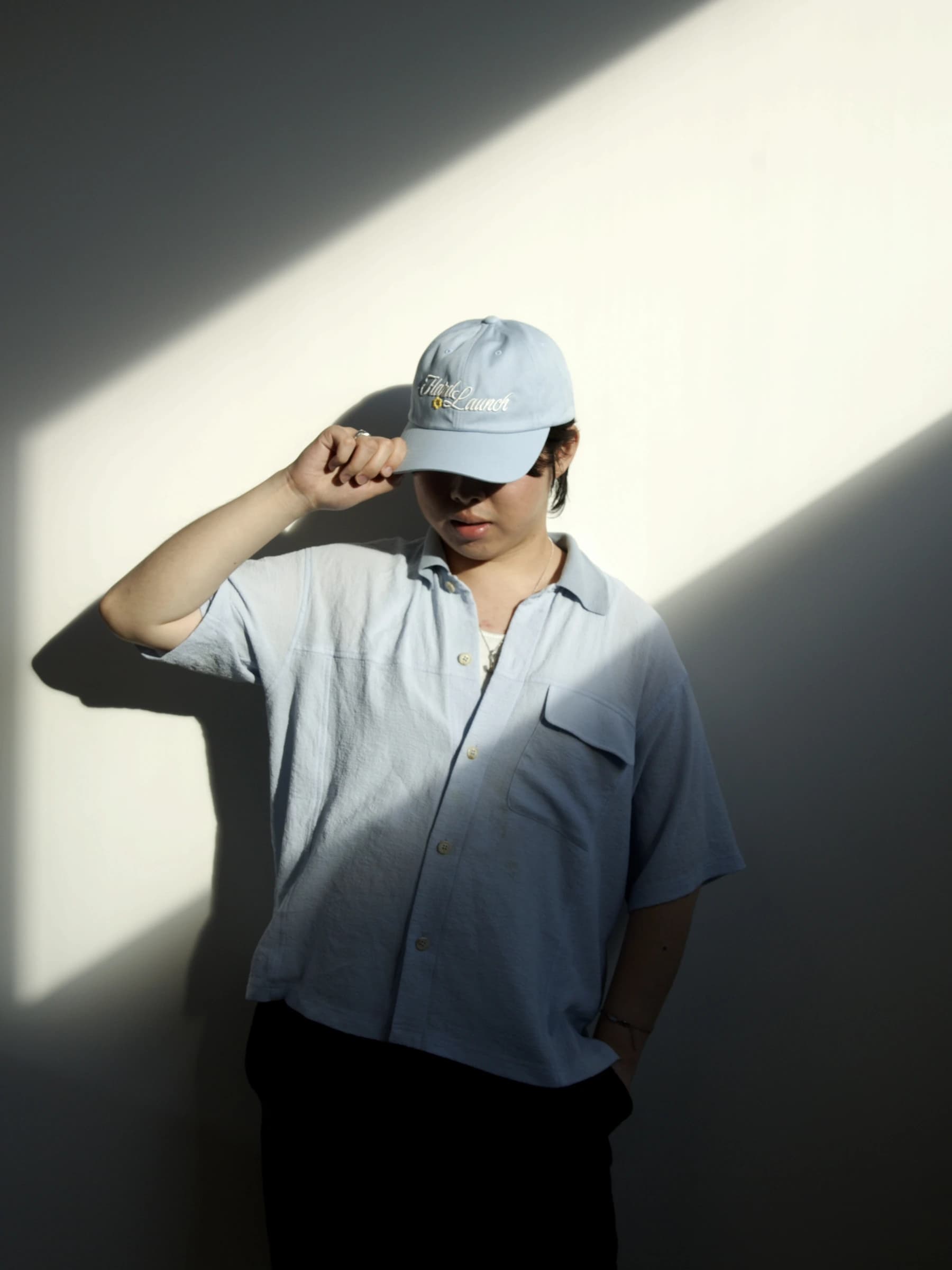 Team member wearing a Tomo cap