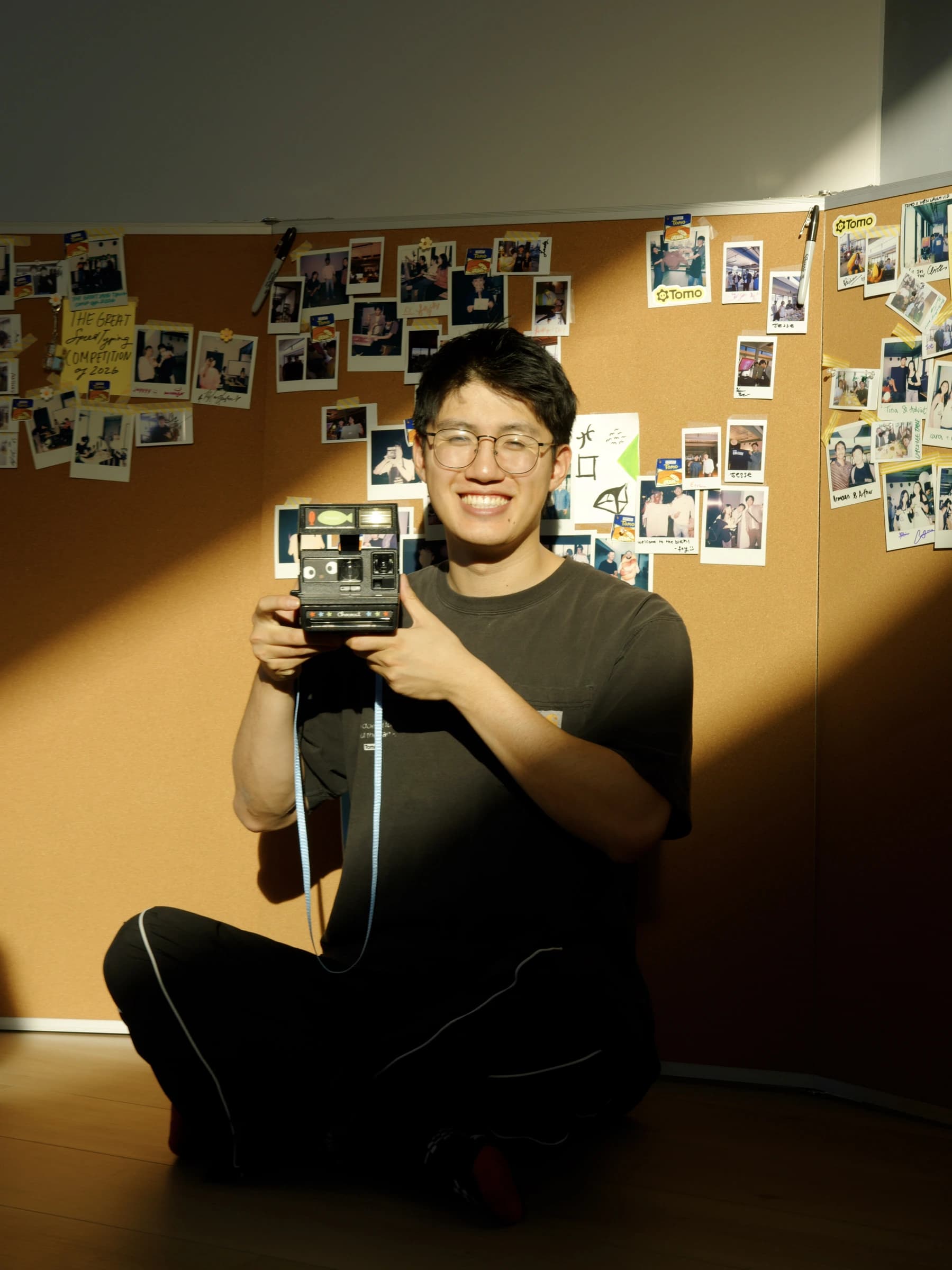 Team member with a Polaroid camera
