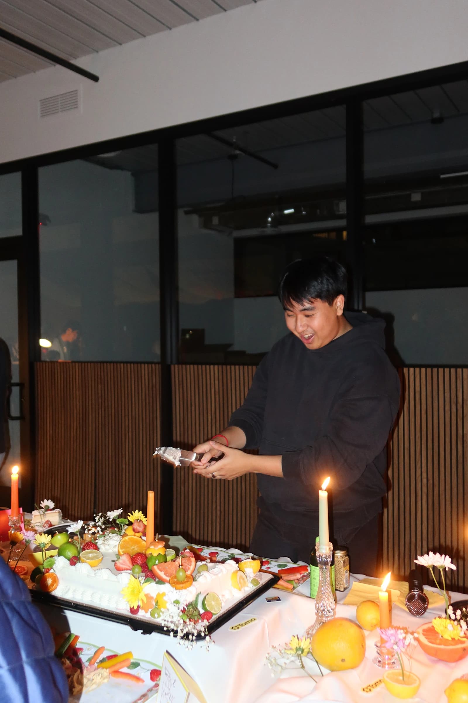 Team celebration with a fruit cake