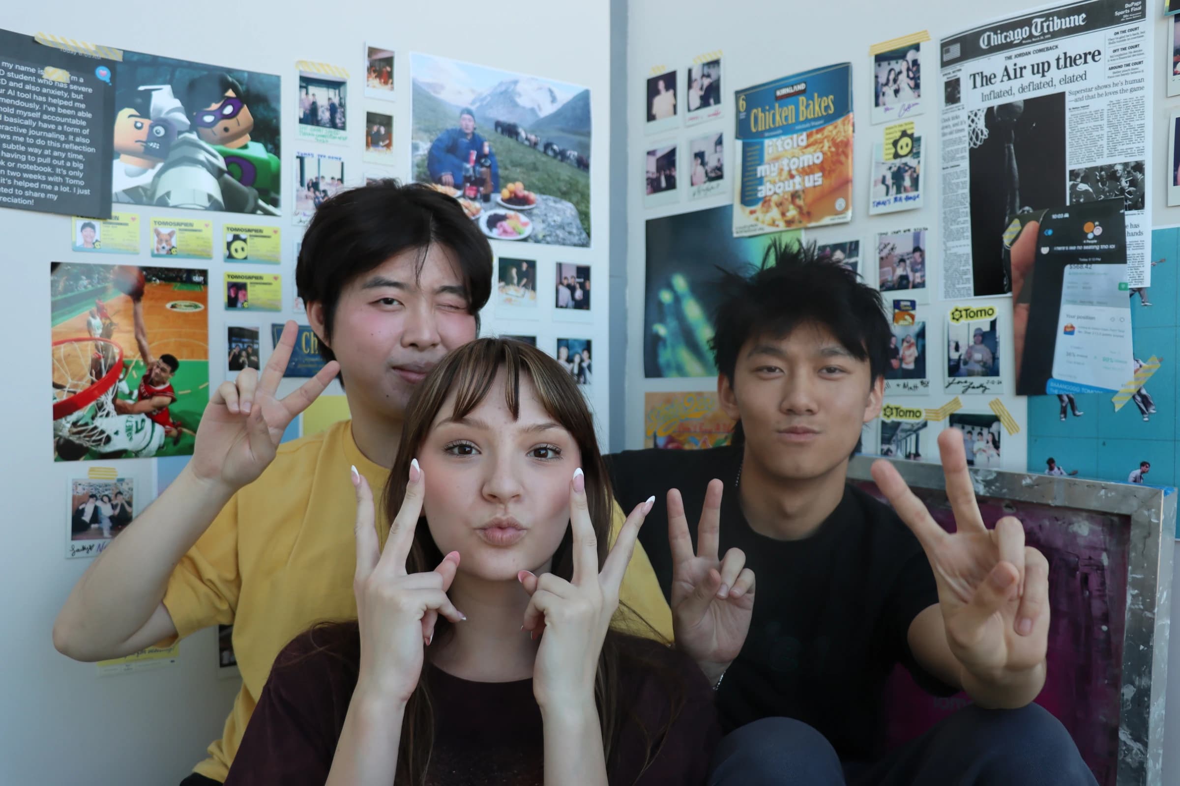 Team posing in front of the office wall